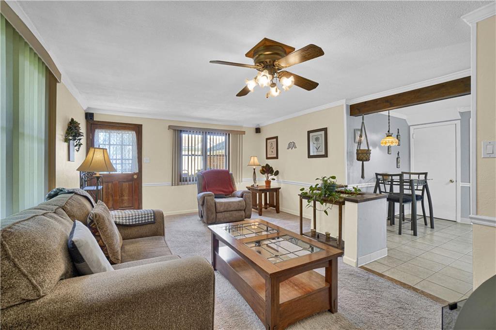 349 Rockhill Road Pittsburgh, PA 15243 - Photo 13 of 25 a living room with furniture a wooden floor and a chandelier