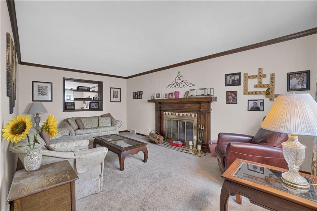 349 Rockhill Road Pittsburgh, PA 15243 - Photo 5 of 25 a living room with furniture and a fireplace