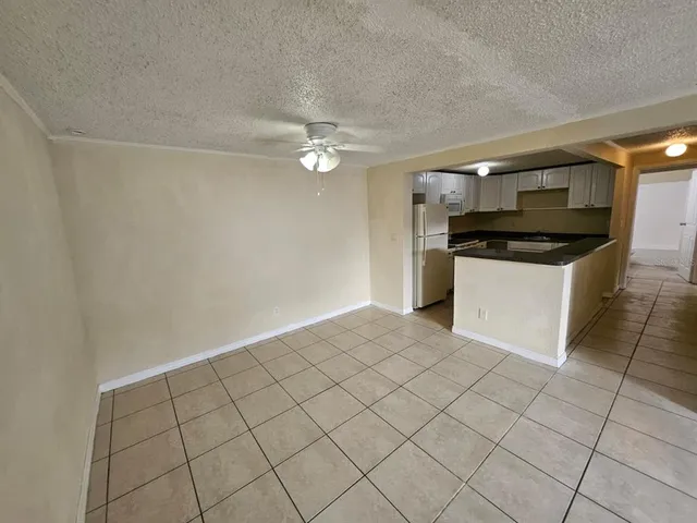 a kitchen with a sink cabinets and appliances
