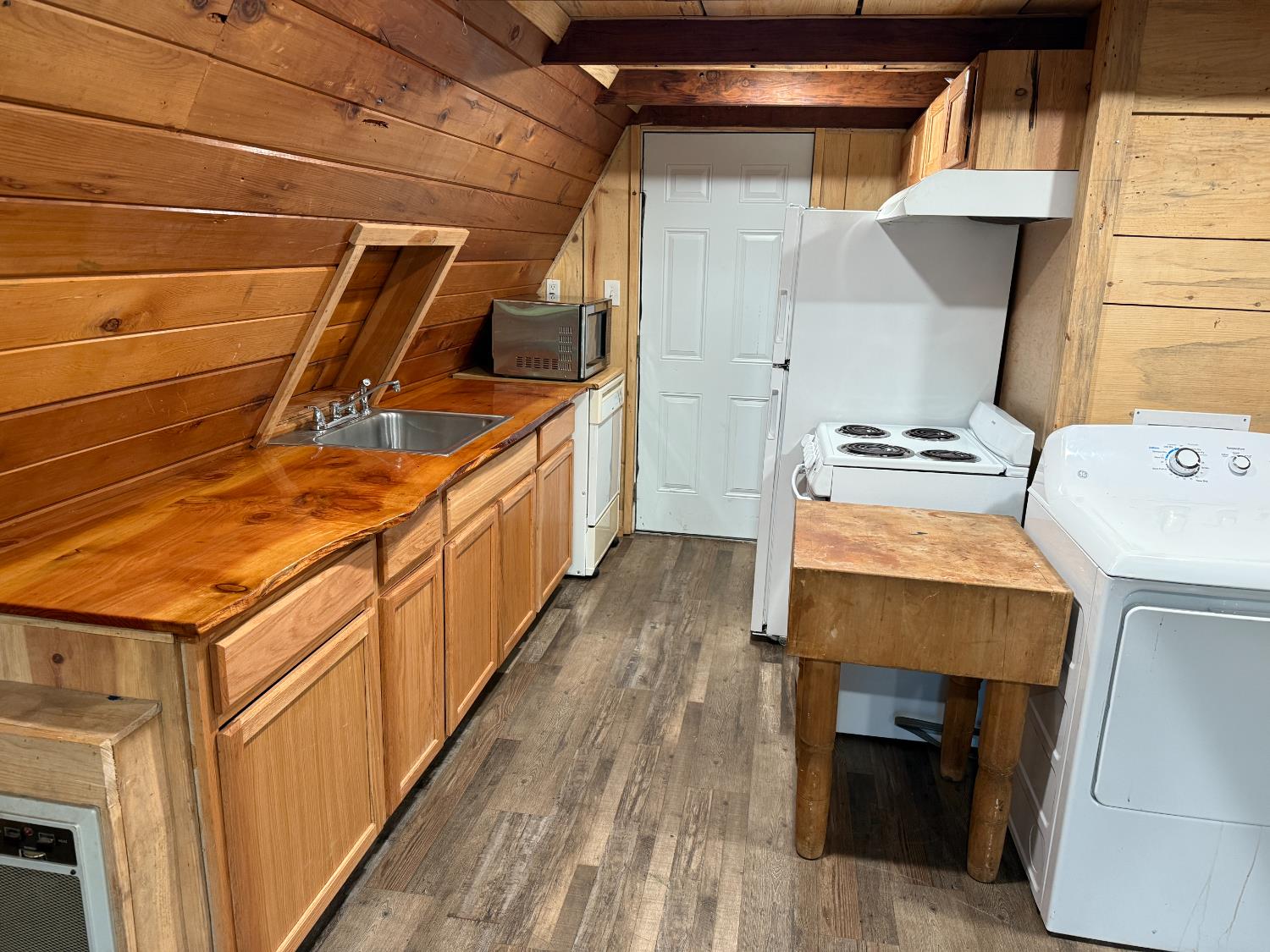 392 Boards Crossing Road Arnold, CA 95223 - Photo 15 of 31 a storage room with wooden floor