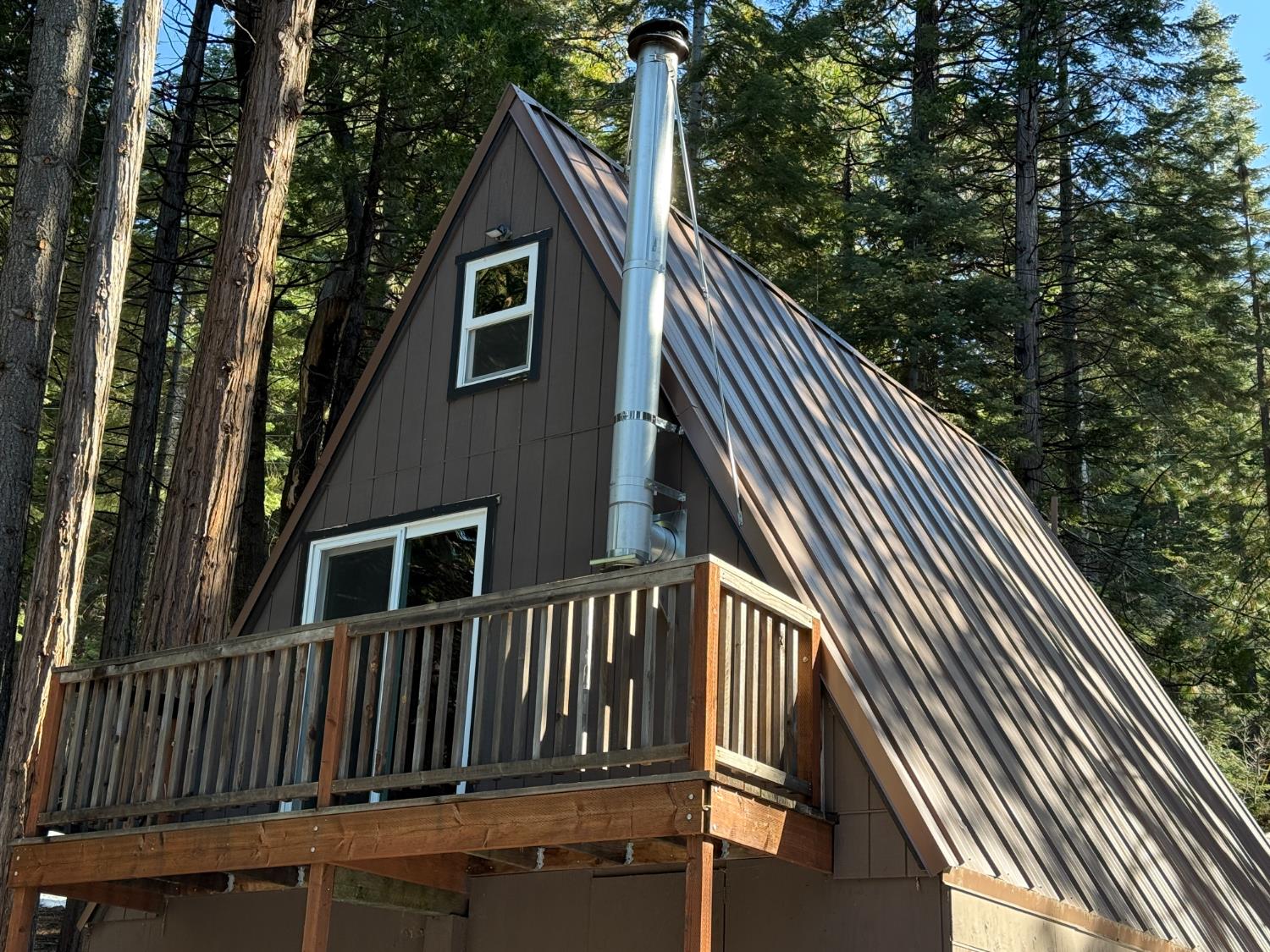 392 Boards Crossing Road Arnold, CA 95223 - Photo 6 of 31 a view of backyard with deck and wooden floor