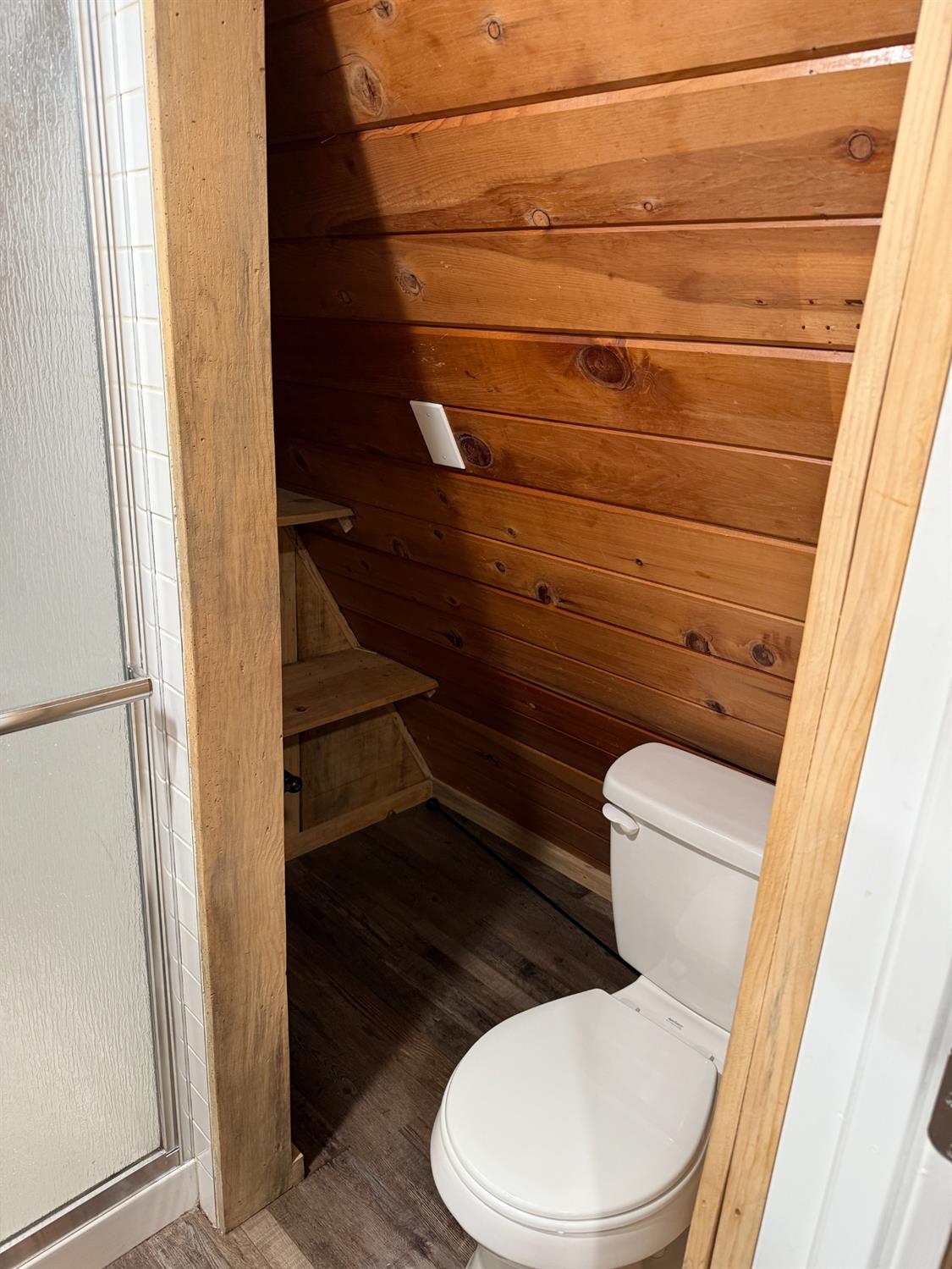 392 Boards Crossing Road Arnold, CA 95223 - Photo 10 of 31 a white toilet sitting next to a window