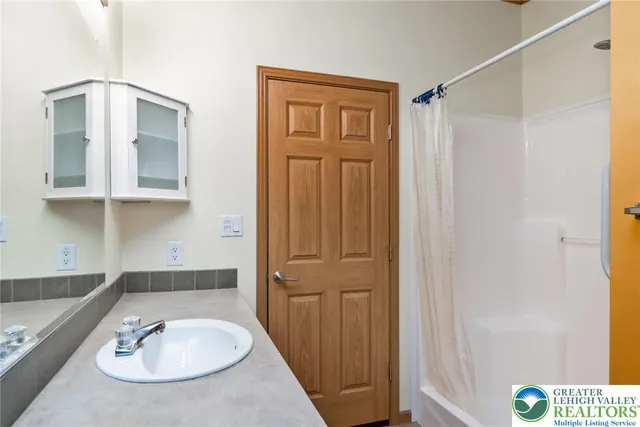 a bathroom with a sink and a mirror