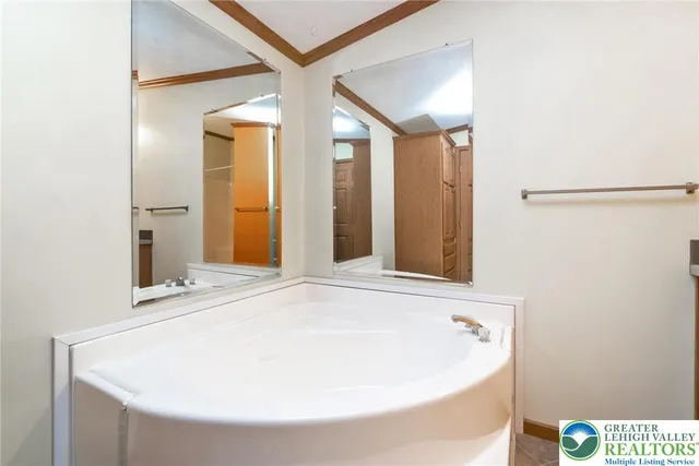 a bathroom with a bathtub and shower