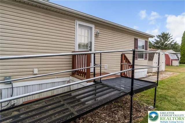 a view of a house with wooden stairs and a wooden floor