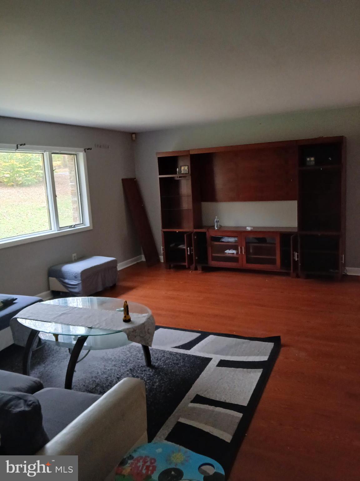 1540 Nicodemus Road Reisterstown, MD 21136 - Photo 3 of 12 a living room with furniture a flat screen tv and a window