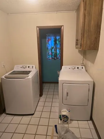 a white toilet sitting next to a small yard