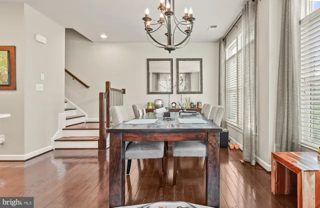 a view of hall way with furniture and staircase