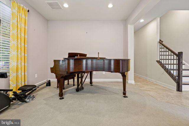 a view of a livingroom with furniture and a window