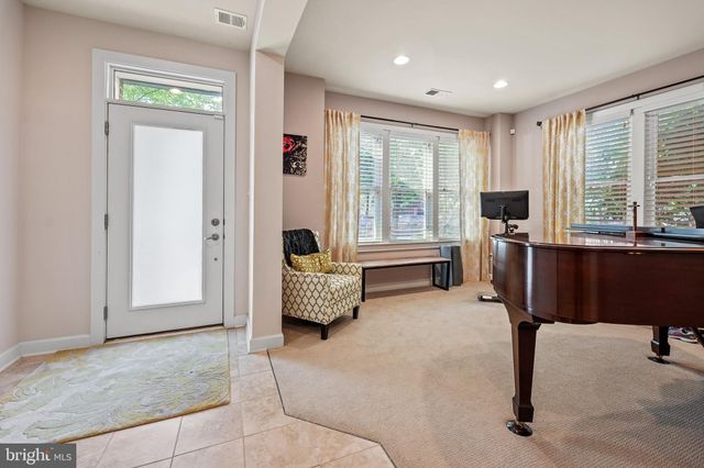 a spacious bedroom with a bed and a couch