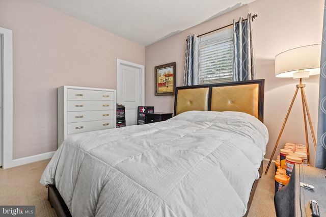 a bedroom with a bed and a closet