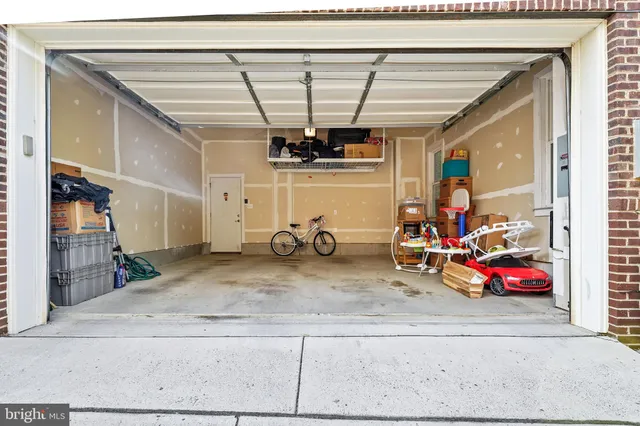 a view of a garage with parked cars