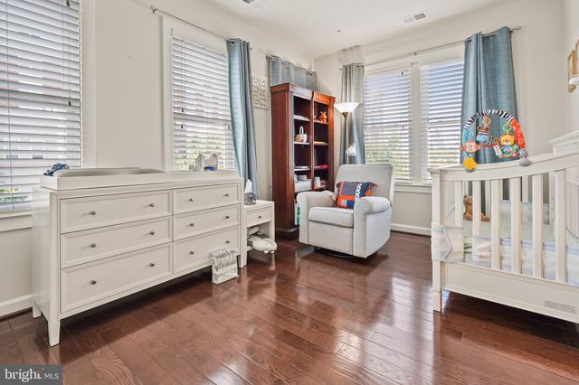 a living room with furniture cabinets and window