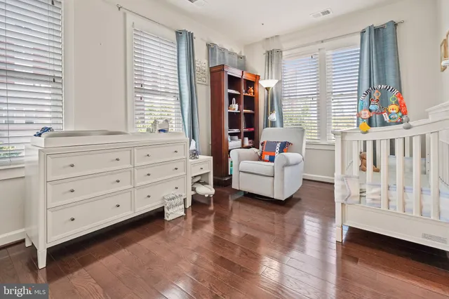 a living room with furniture cabinets and window