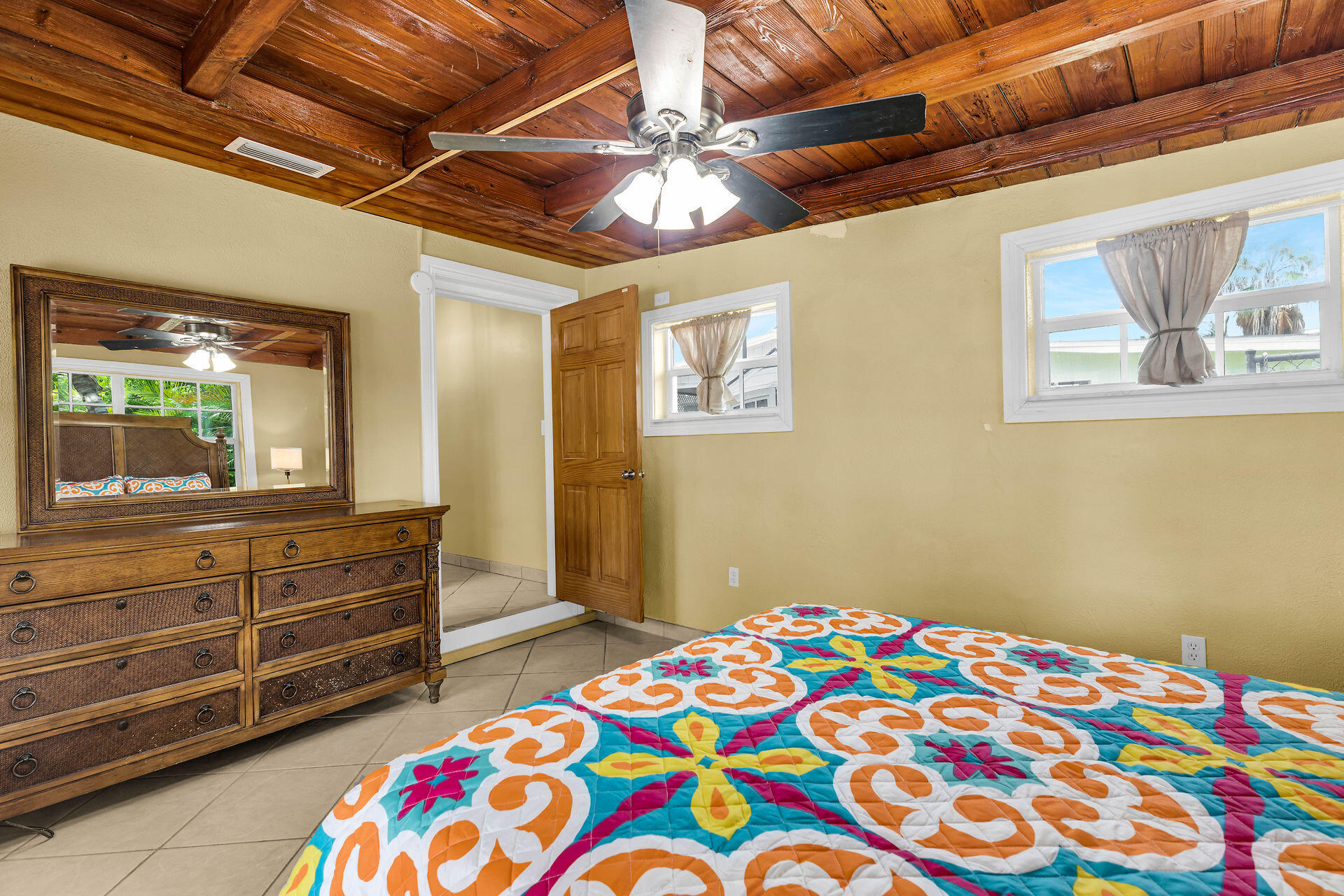33 Bay Drive Key West, FL 33040 - Photo 23 of 35 a bedroom with a bed and a dresser