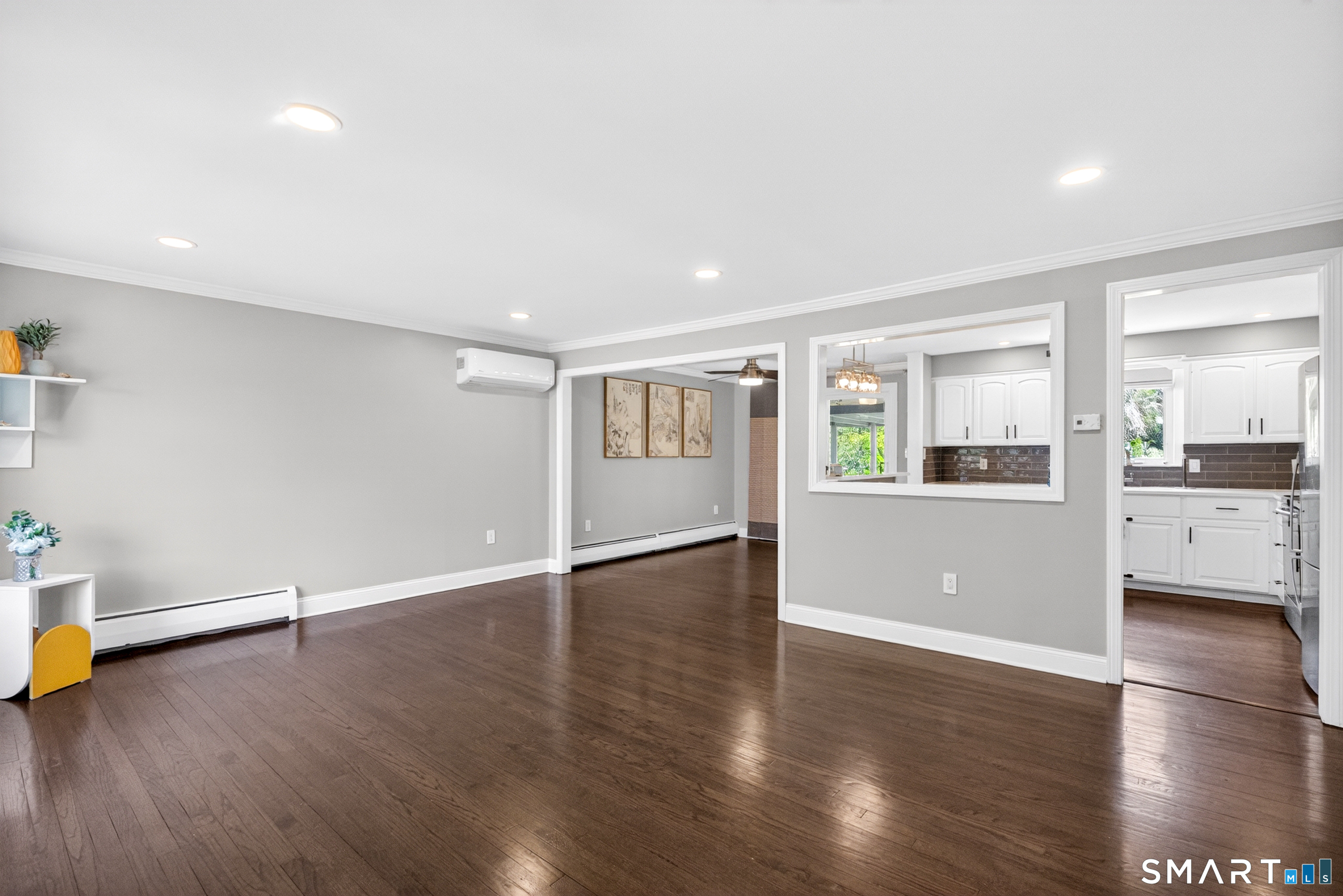 568 Wiese Road Cheshire, CT 06410 - Photo 11 of 40 a view of an empty room with wooden floor and a window