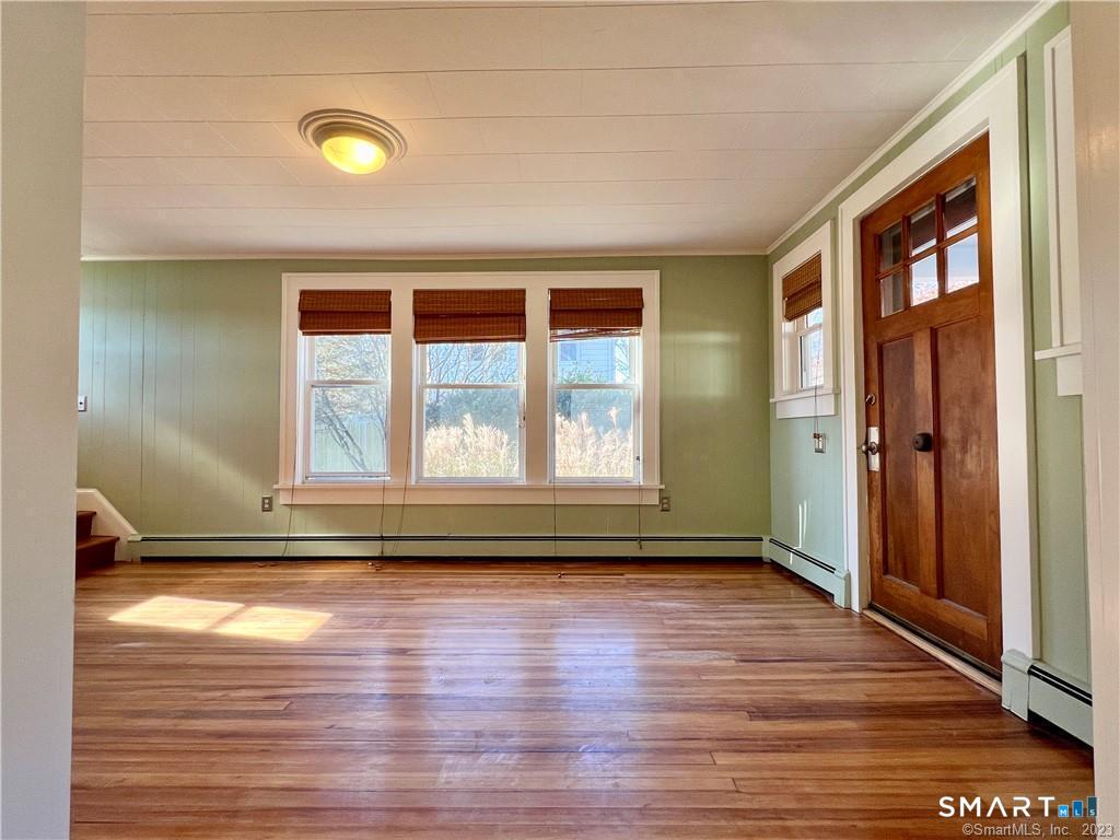 75 Portland Avenue, Unit 77 Redding, CT 06896 - Photo 11 of 23 Dining room view into Livingroom