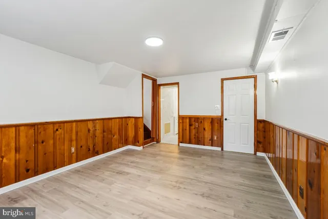 a view of entryway with wooden floor