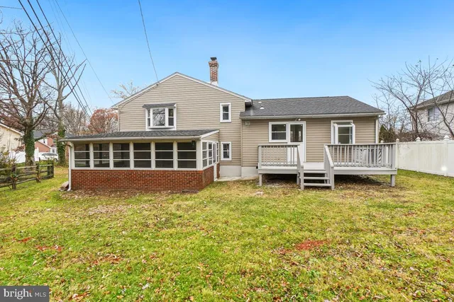 a view of a house with a large window and yard