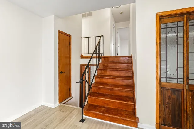 a view of entryway with wooden floor