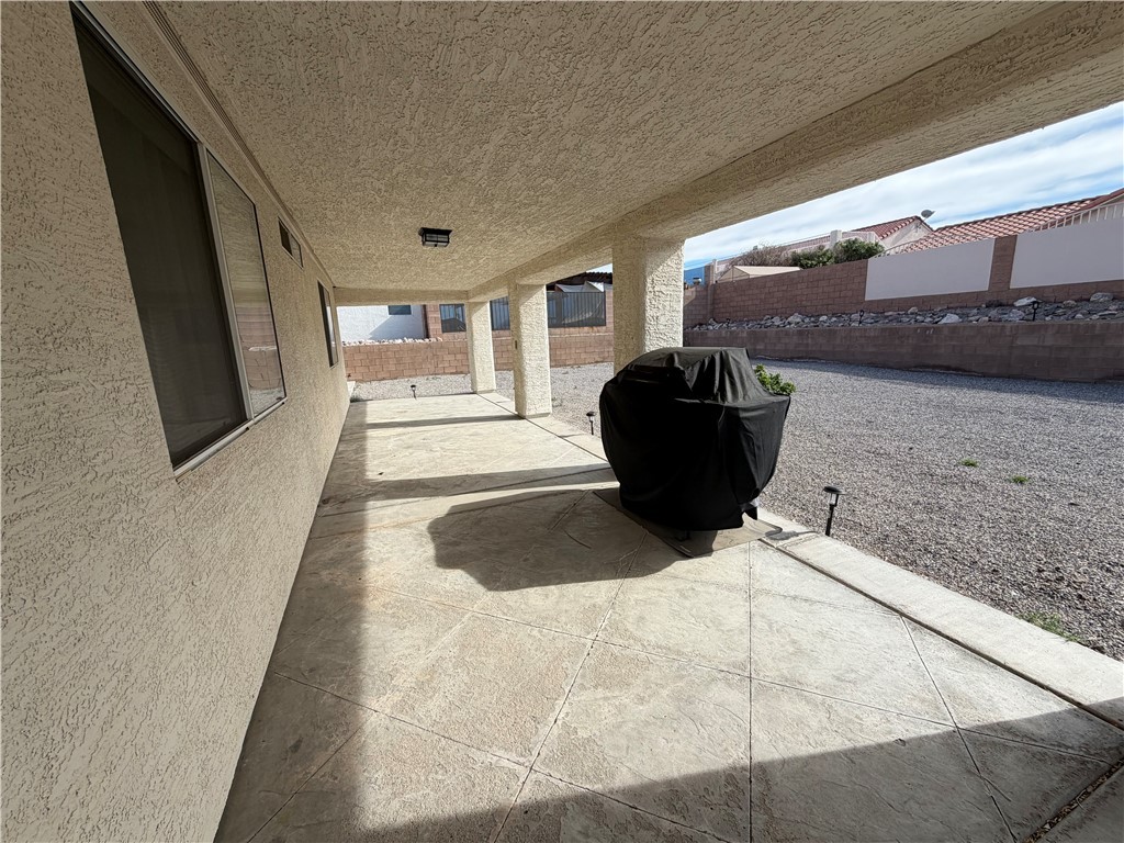 2416 North Ridge Avenue Bullhead City, AZ 86429 - Photo 30 of 33 Fenced backyard featuring a patio and grilling area
