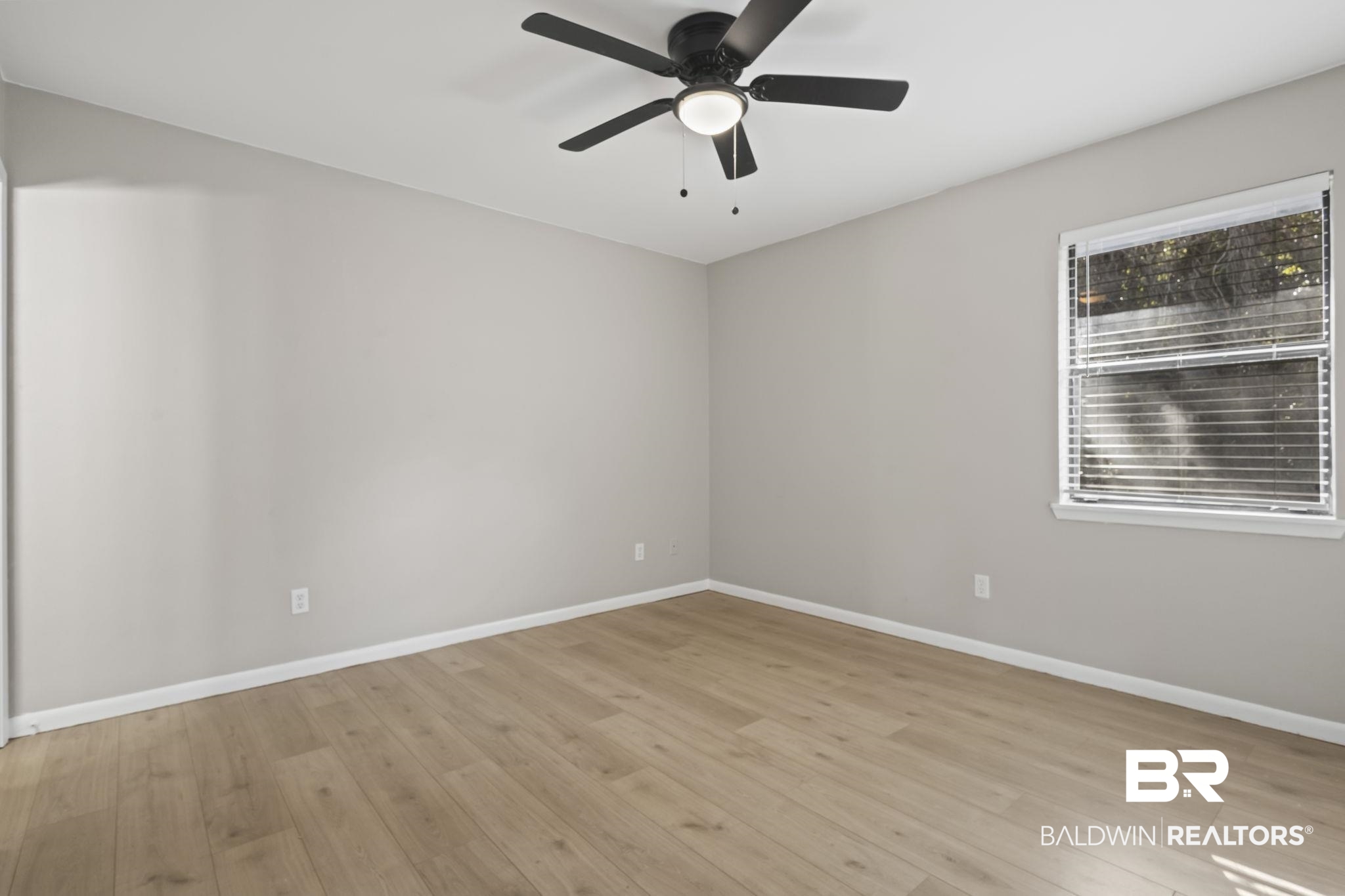 309 West Roosevelt Avenue Foley, AL 36535 - Photo 17 of 60 Empty room featuring ceiling fan and light wood-type flooring