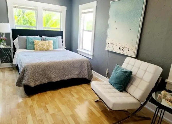 a bedroom with a bed and window