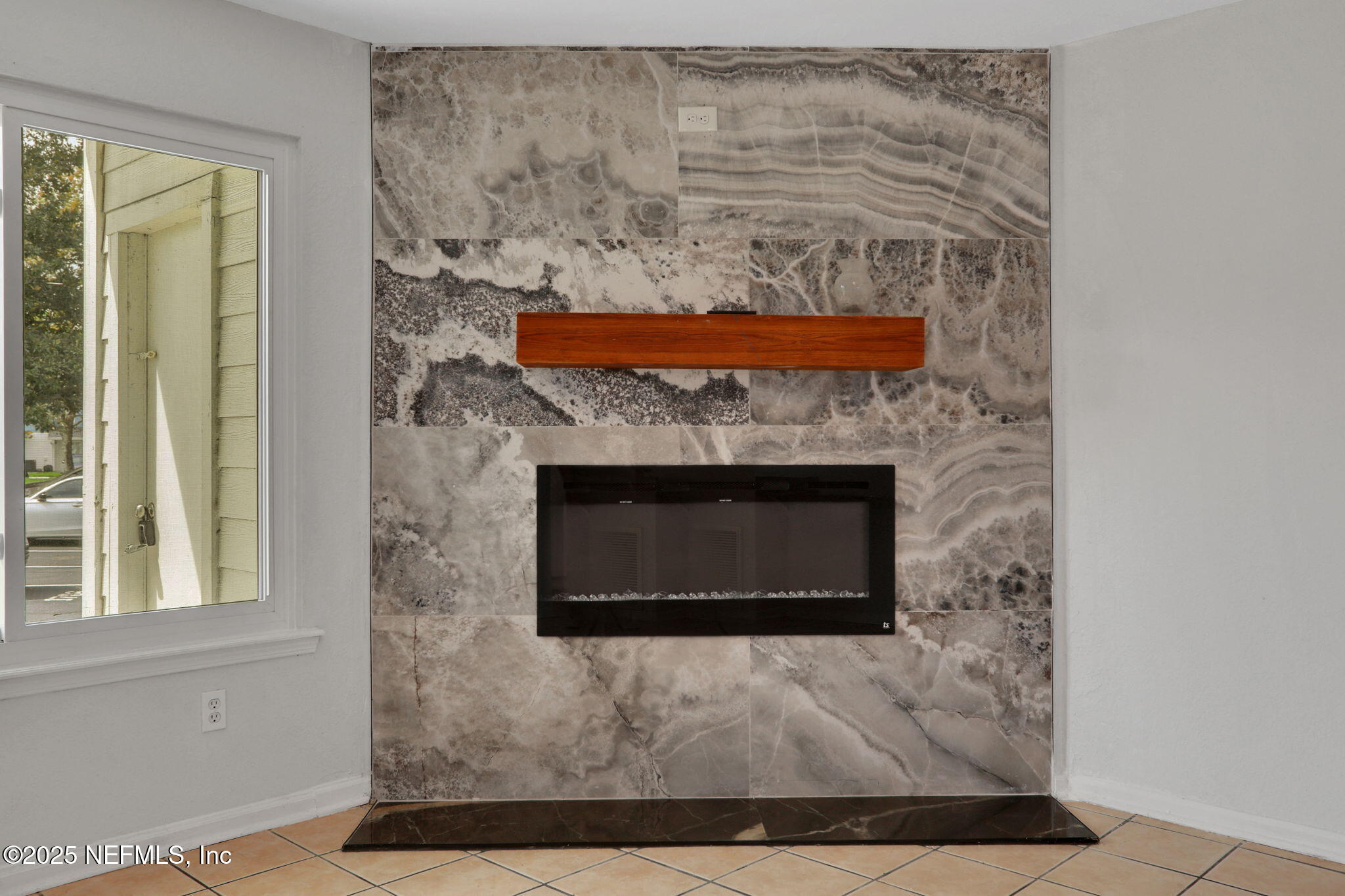 791 Assisi Lane, Unit 1704 Jacksonville, FL 32233 - Photo 3 of 16 a living room with a fireplace