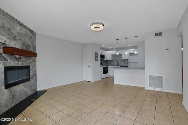 a view of a kitchen with furniture and a fireplace