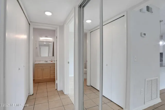 a bathroom with a shower and a sink