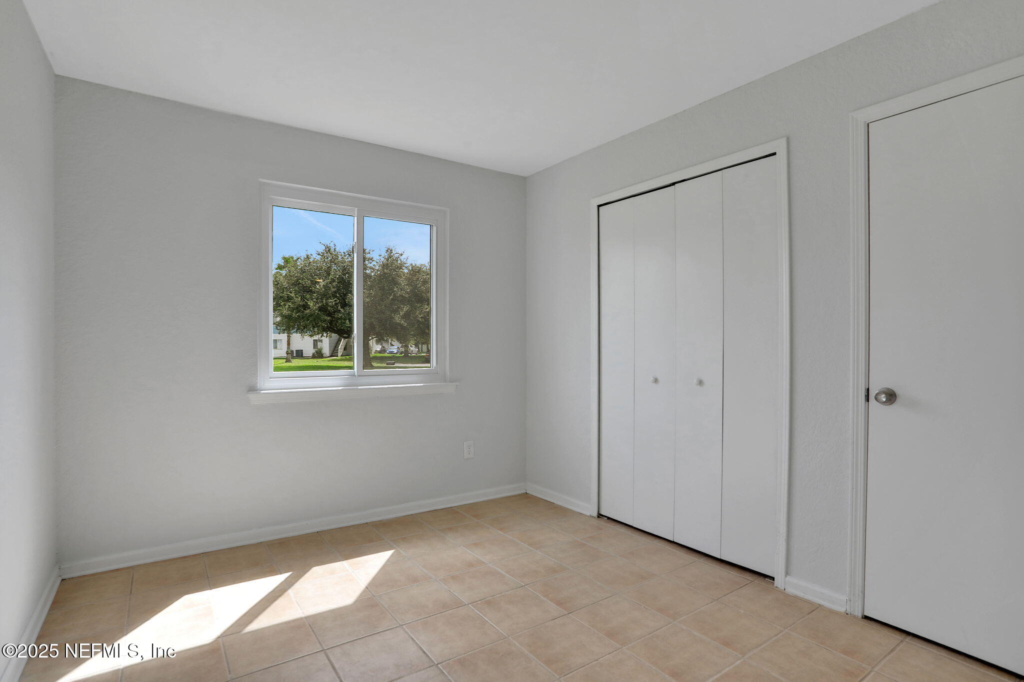 791 Assisi Lane, Unit 1704 Jacksonville, FL 32233 - Photo 10 of 16 a view of an empty room with a window