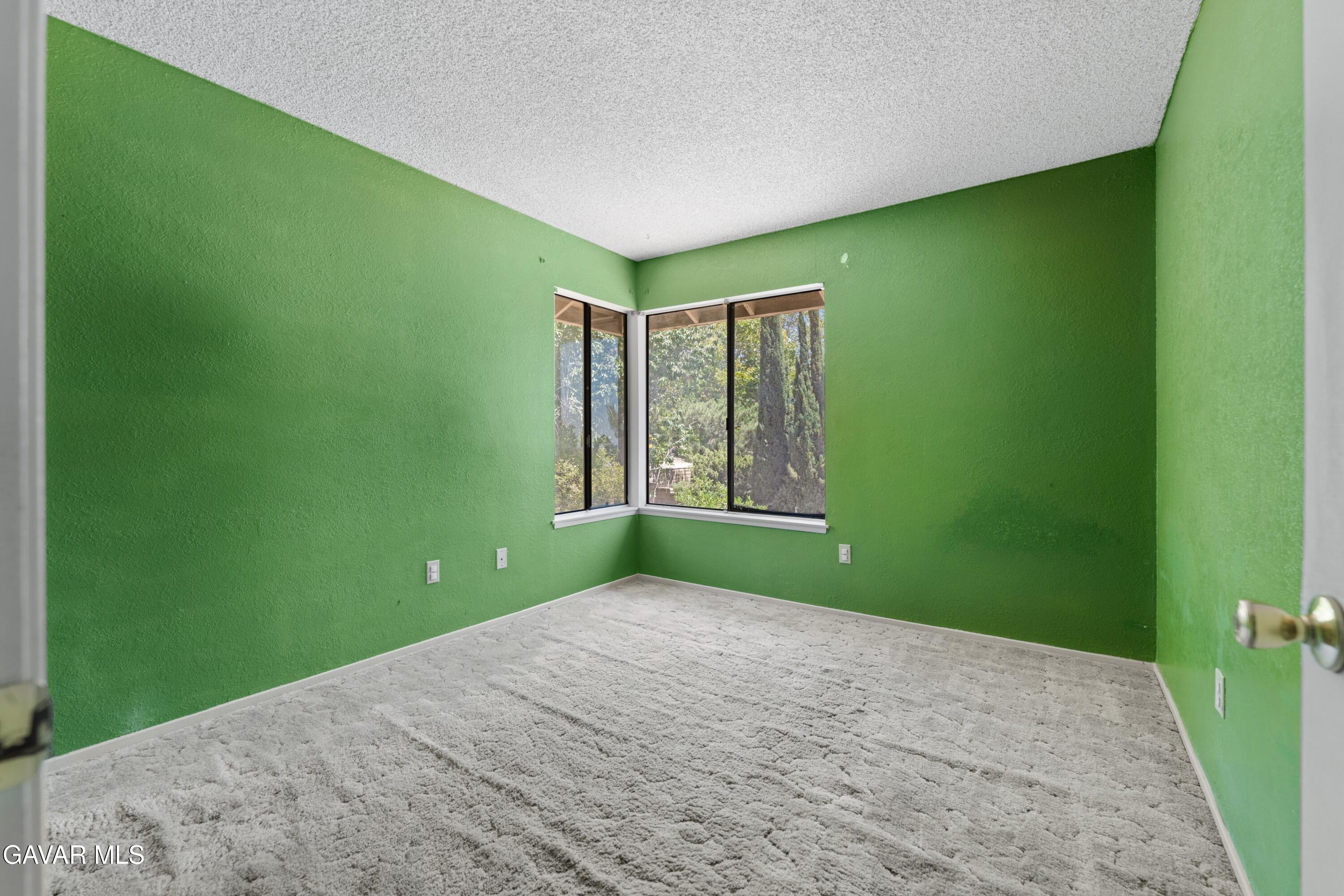 6113 Sard Street Rancho Cucamonga, CA 91701 - Photo 18 of 26 a view of a big room with windows and chandelier