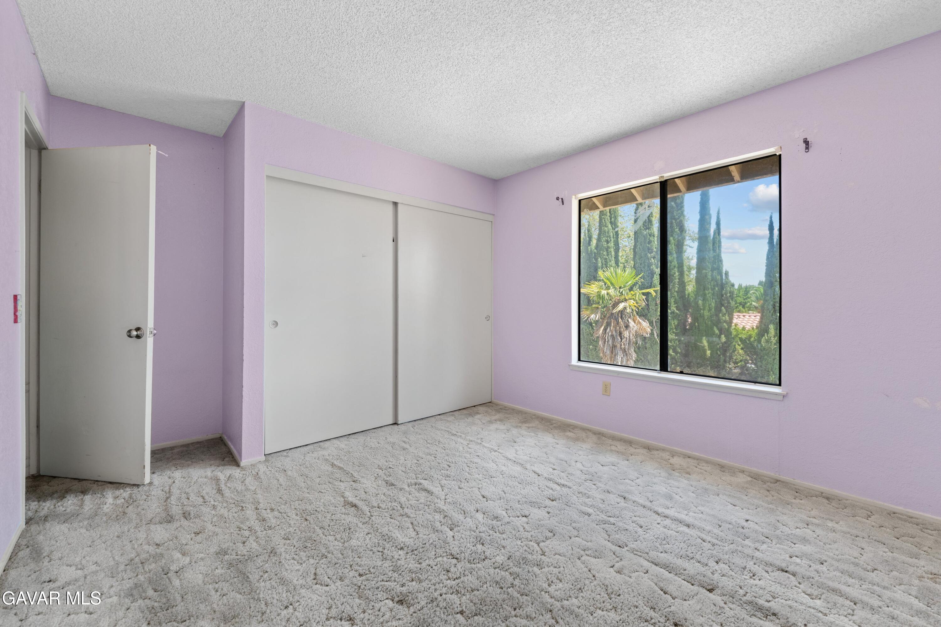 6113 Sard Street Rancho Cucamonga, CA 91701 - Photo 19 of 26 an empty room with windows and closet