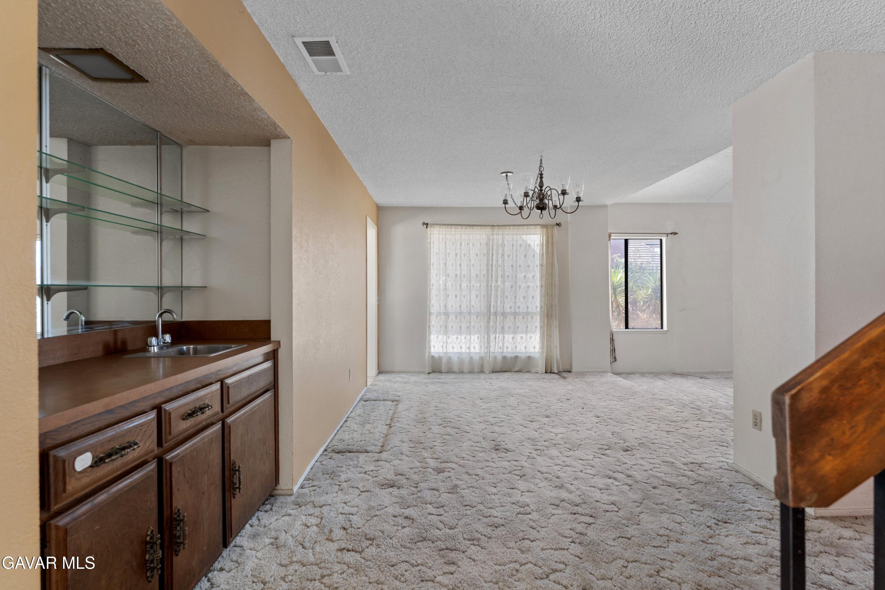 6113 Sard Street Rancho Cucamonga, CA 91701 - Photo 6 of 26 a kitchen with a sink and cabinets