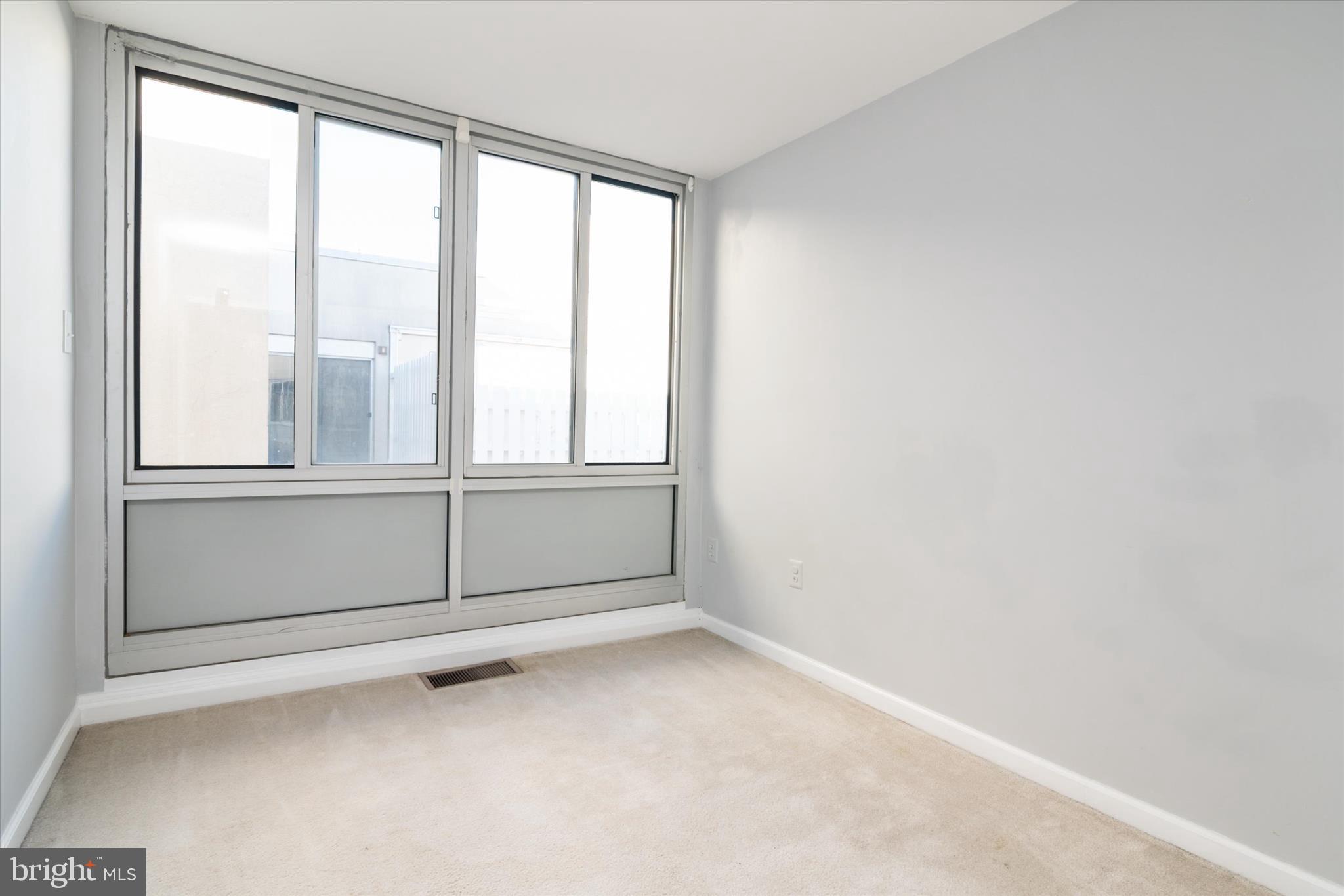 28 Allegheny Avenue, Unit 2710 Towson, MD 21204 - Photo 20 of 40 an empty room with windows