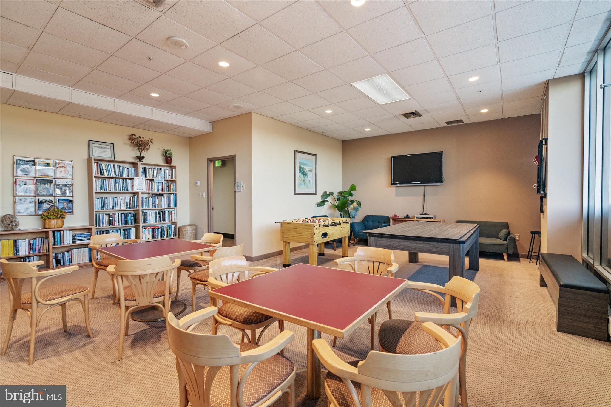 28 Allegheny Avenue, Unit 2710 Towson, MD 21204 - Photo 34 of 40 a outdoor dining room with furniture a rug and a flat screen tv