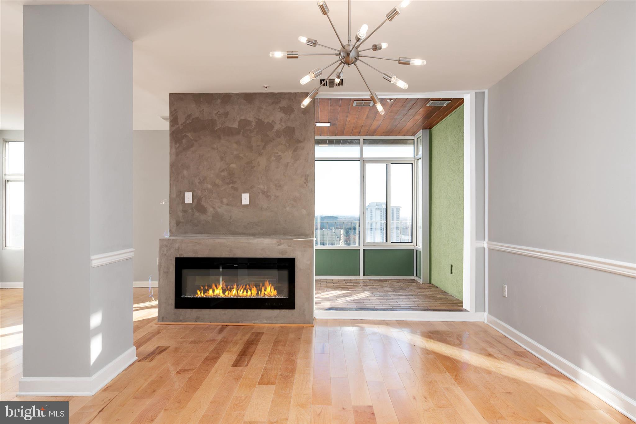 28 Allegheny Avenue, Unit 2710 Towson, MD 21204 - Photo 5 of 40 a living room with furniture and a fireplace