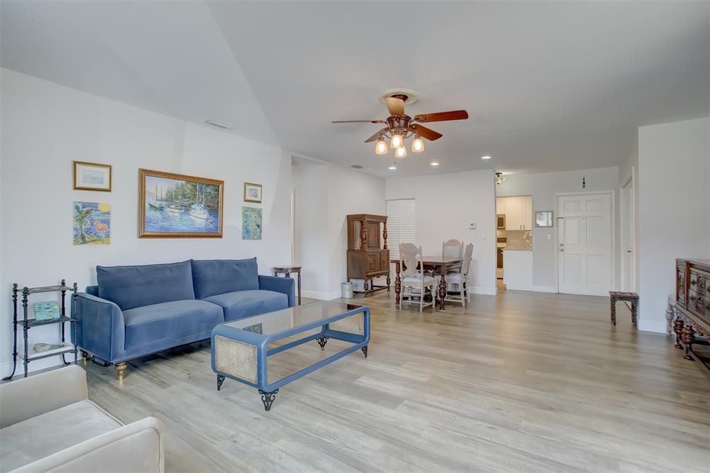 1450 North Riverside Drive, Unit 101 Pompano Beach, FL 33062 - Photo 15 of 52 a living room with furniture and wooden floor