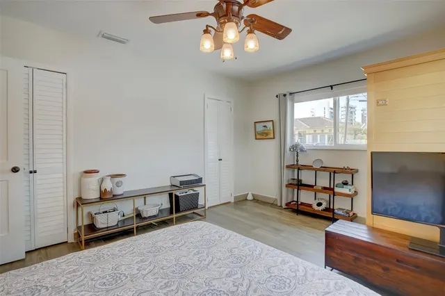 a bedroom with furniture and a window