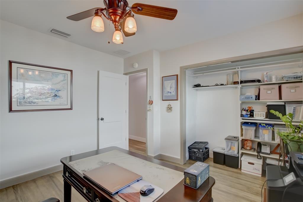 1450 North Riverside Drive, Unit 101 Pompano Beach, FL 33062 - Photo 29 of 52 a view of a workspace with furniture and a window