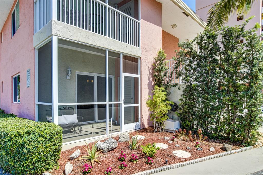 1450 North Riverside Drive, Unit 101 Pompano Beach, FL 33062 - Photo 38 of 52 a front view of a house with garden