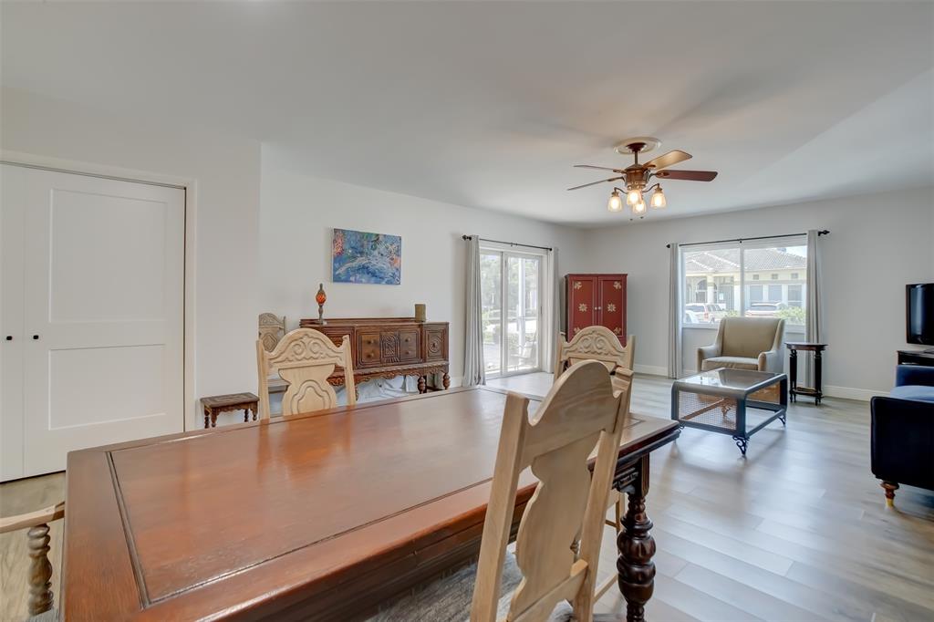 1450 North Riverside Drive, Unit 101 Pompano Beach, FL 33062 - Photo 10 of 52 a view of a workspace with furniture and wooden floor