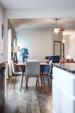 a dining room with furniture and window