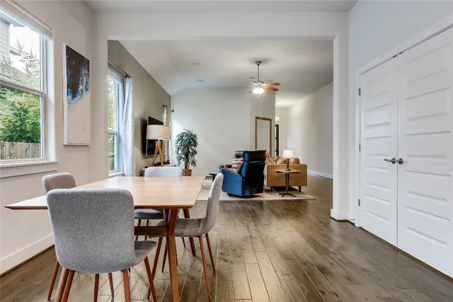 a view of a dining room with furniture and wooden floor
