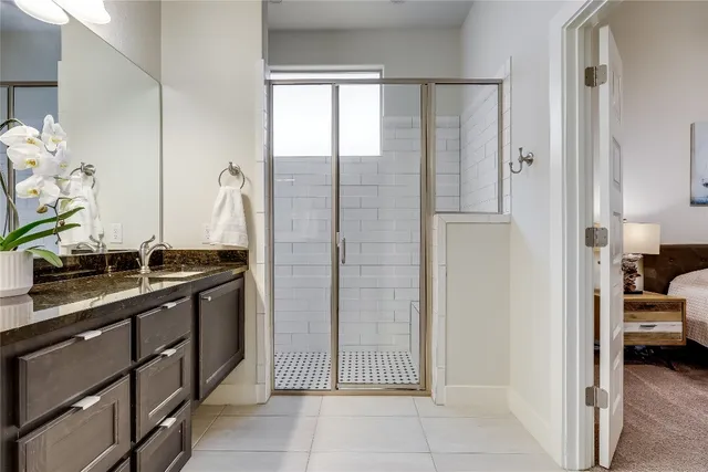 a bathroom with a double vanity sink and a mirror