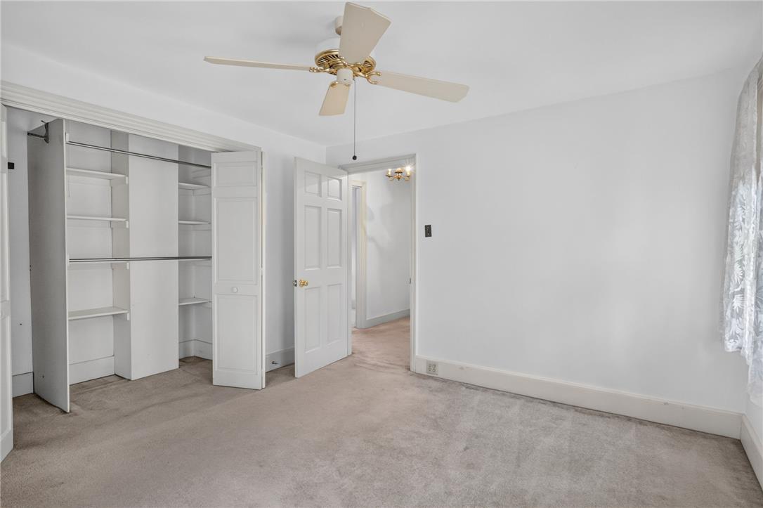 765 East Macada Road Bethlehem, PA 18017 - Photo 27 of 46 Well-lit sleeping quarters with a ceiling fan, closet, and carpeted flooring for comfort.