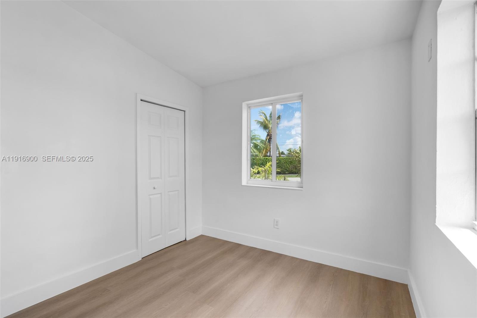 11030 Southwest 42nd Street Miami, FL 33165 - Photo 14 of 34 an empty room with a window