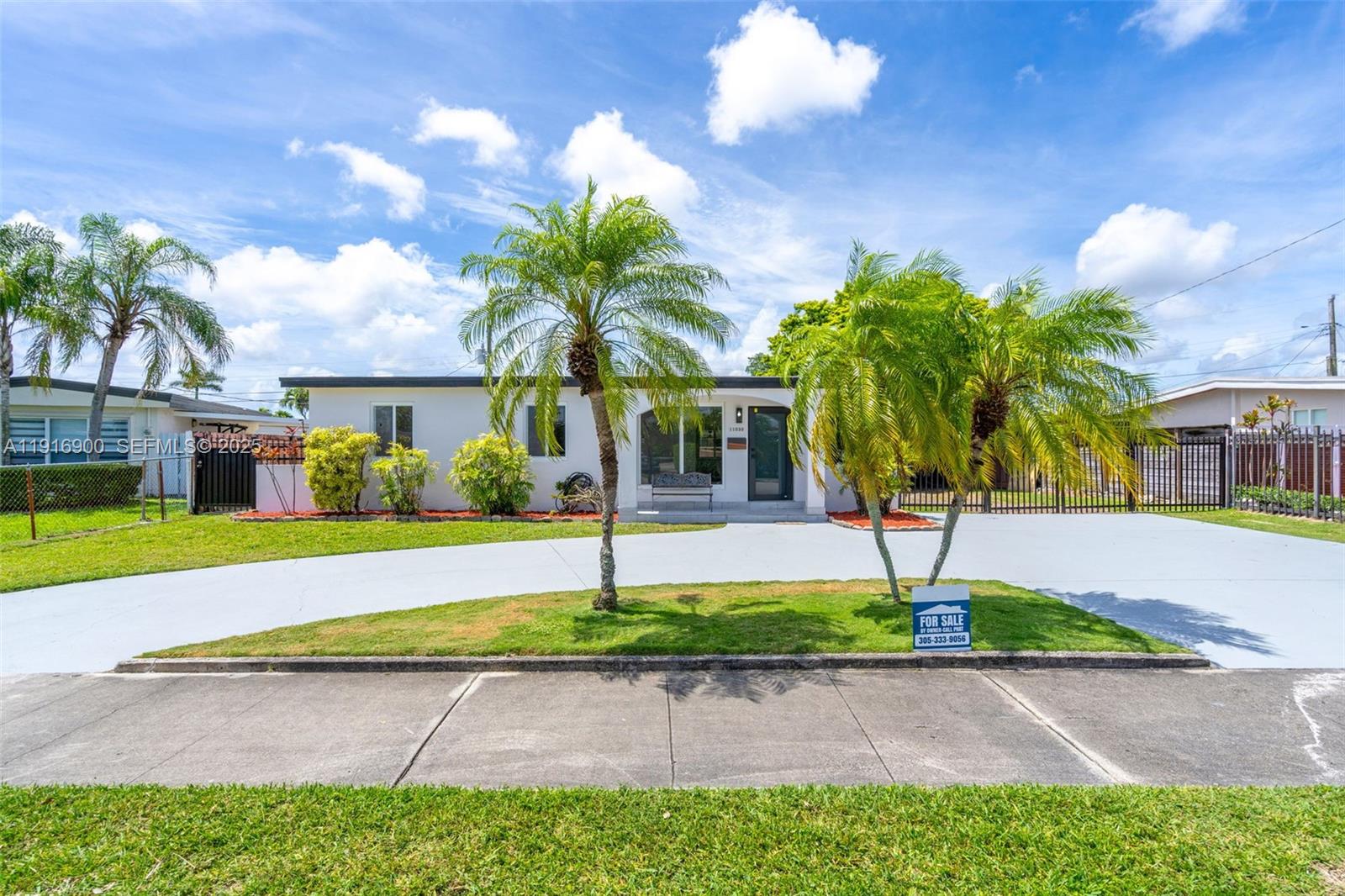 11030 Southwest 42nd Street Miami, FL 33165 - Photo 2 of 34 a front view of a house with garden