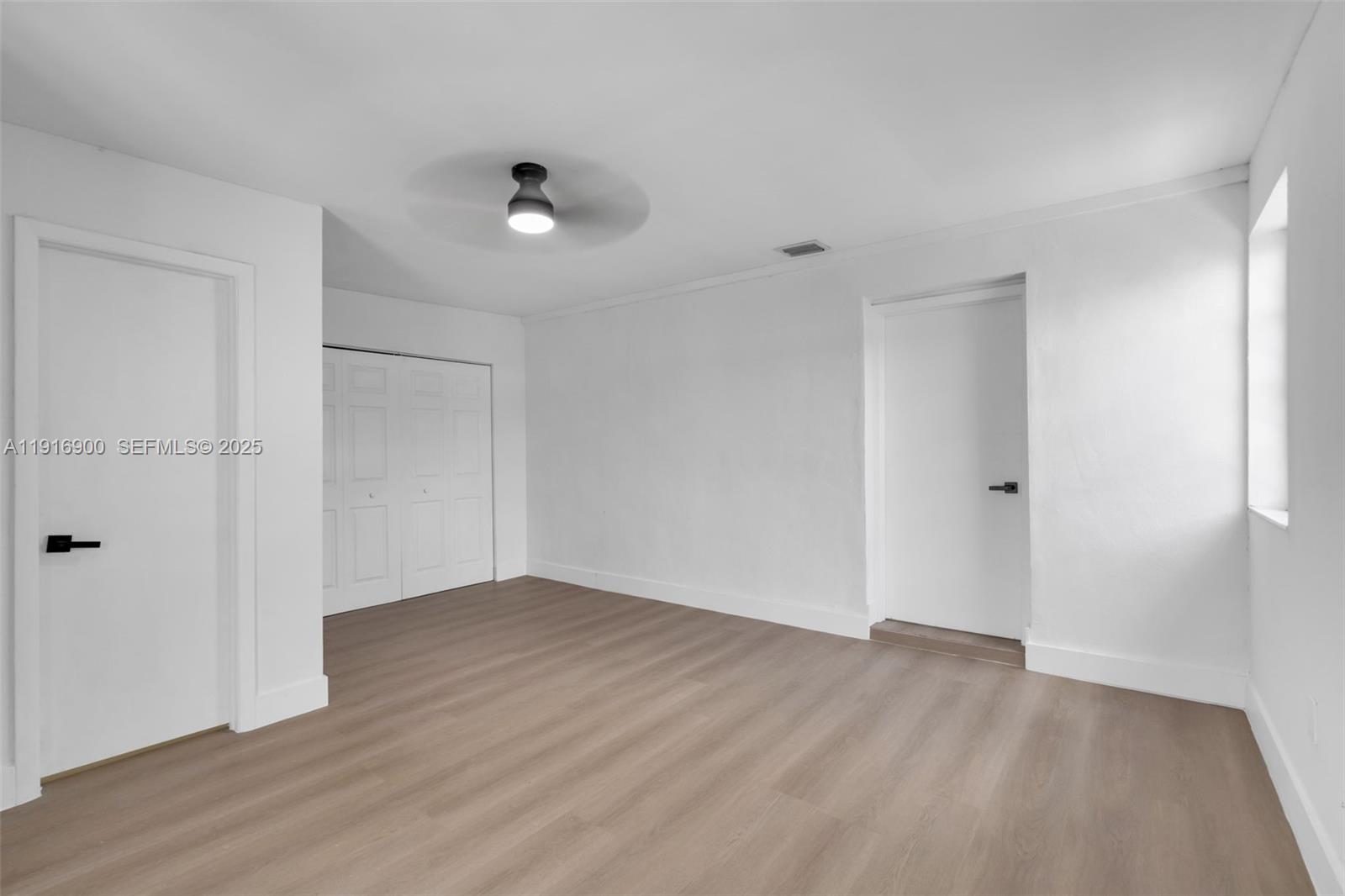 11030 Southwest 42nd Street Miami, FL 33165 - Photo 21 of 34 wooden floor in an empty room