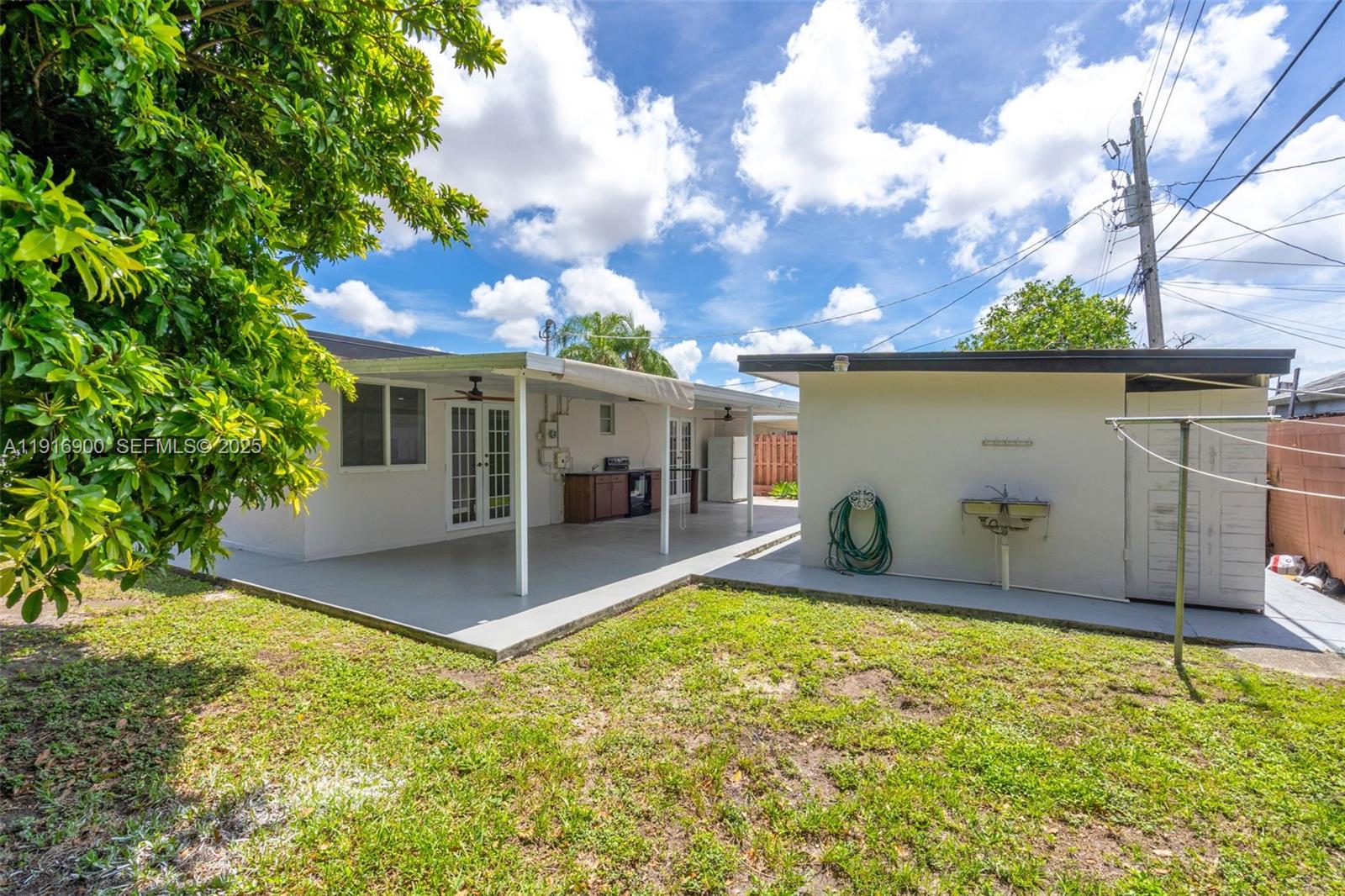 11030 Southwest 42nd Street Miami, FL 33165 - Photo 25 of 34 a view of a house with backyard